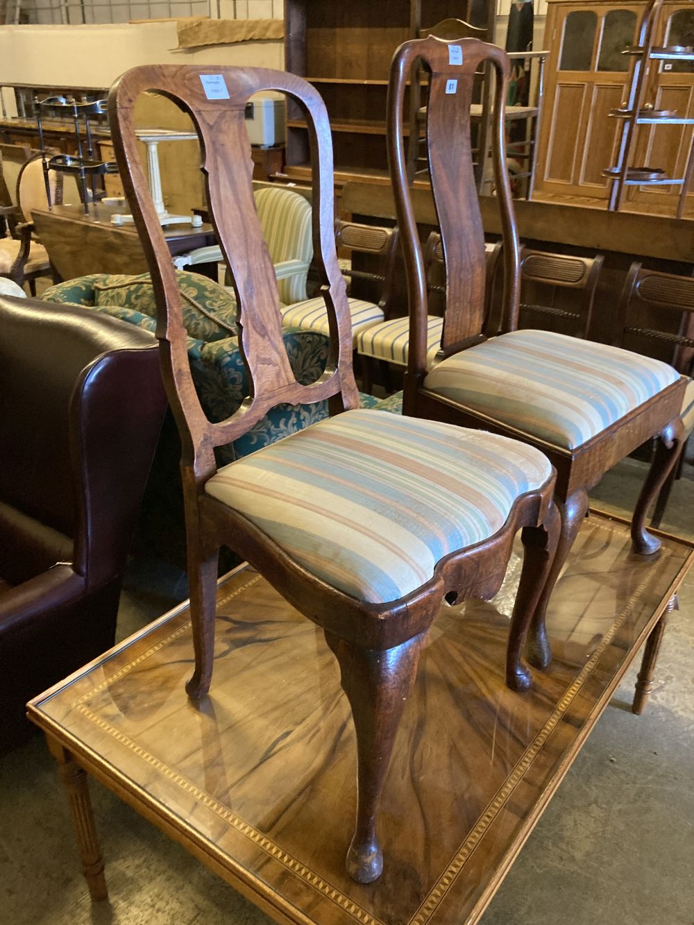 Two early 18th century walnut dining chairs